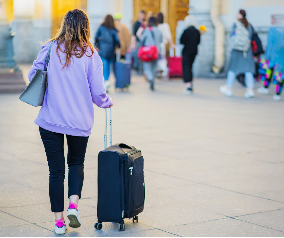 nurse traveling while pulling suitcase